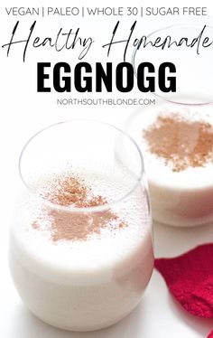 two glasses filled with eggnog on top of a table