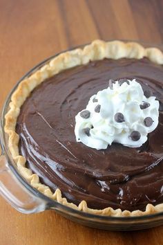 a chocolate pie with whipped cream on top