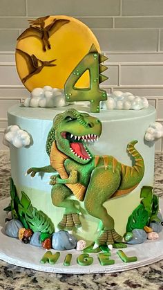 a dinosaur birthday cake with the number four on it's top and an image of a t - rex