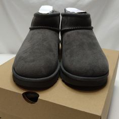 New In Original Box. Shoes May Have Been Tried On In Store Only Style: 1116109 Color: Grey Protected: Post Applied Treatment Topically Applied Water Repellency Treatment 17mm Twinface Sheepskin Upper Asymmetrical Topline, Overlock Stitch Detailing On Seams, Rear Pull Tab, Suede Heel Counter 17mm Sheepskin Lining 17mm Uggplush 80% Upcycled Wool, 20% Tencel Lyocell Sockliner Or 17mm Uggplush 60% Upcycled Wool, 40% Tencel Lyocell Sockliner Sugarcane Eva Outsole Or Treadlite By Ugg Eva Outsole Polye Ultra Mini Boots, Mini Boots, Overlock Stitch, Ugg Classic Ultra Mini, Shoes Ugg, Box Shoes, Ugg Classic, Real Fur, Suede Heels