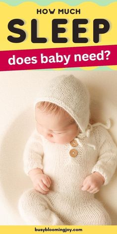 a baby wearing a white knitted outfit with the words how much sleep does baby need?