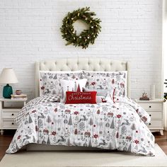 a christmas themed bed in a white bedroom