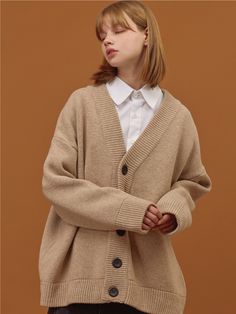 Editor's NotesCPGN’s cardigan gives casual look with wool blend fabric and basic design.- V-neck cardigan- Oversized fit- Long sleeves with drop shoulder- Ribbed cuffs and hem- Button closure- Wool blend fabricMeasurements(in.)S / M / L- Length: 27.6in. / 28.3in. / 29.5in.- Shoulder: 24.4in. / 27.2in. / 29.5in.- Chest: 26.0in. / 29.5in. / 31.9in.- Sleeve: 17.3in. / 18.5in. / 20.1in.*Model Info: 5’8’’ Fitting Size MComposition & Care- 50% Wool, 50% Acrylic- Dry clean recommendedDesigner- by CPGN Oversize Cardigan Outfit, Beige Cardigan Outfit, Cardigan Outfit Casual, Oversized Cardigan Outfit, Drop Shoulder Cardigan, Tan Cardigan, Oversized Sweater Cardigan, Cardigan Oversized, Open Sweater