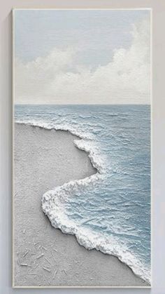 an ocean scene with waves coming in from the water and white sand on the beach