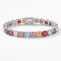 Elevate your wrist game with the Multicolor Moissanite Silver Tennis Chain Bracelet. This stunning accessory features a certified, hand-picked multi color moissanite stones by GRA that will leave you mesmerized. Crafted with premium 925 sterling silver, this bracelet is sure to make a statement wherever you wear it. Details Material 925 Sterling Silver Length 7"/ 7.5"/ 8"/ 8.5" Color Grade D Clarity Grade VVS1 Cut Grade Excellent Package content A chain, a gift box, a warranty card, a GRA moissanite report Tennis Chain, Wrist Game, Color Grading, Hand Picked, Chain Bracelet, Tennis, Multi Color, Gift Box, 925 Sterling Silver