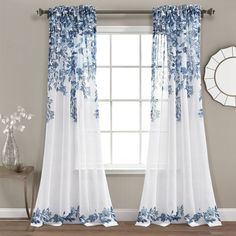 the curtains in this room are blue and white