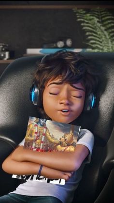 a young boy wearing headphones is sleeping in a chair with his eyes closed while listening to music