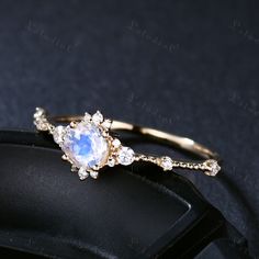 This is 5mm round cut moonstone engagement ring yellow gold. The accent stones are VVS man made cz diamond. The stones can be replace with other gemstones.For example,if you don't like the CZ accent,you can ask me replace it with tourmaline,aquamarine,diamond,emerald,sapphire... For custom making jewelry,it can be made in 2 different metal(Please contact me if you need this one made in solid gold). 1,Solid gold,including 14/18k white/rose/yellow gold. 2,925 sterling silver with white/yellow/rose Moonstone Promise Ring, Gold Moonstone Ring With Diamond Accents For Promise, Dainty Diamond Moonstone Ring For Wedding, Anniversary Yellow Gold Moonstone Ring With Diamond Accents, Round Moonstone Ring With Diamond Accents As Gift, Wedding Moonstone Ring With Diamond Accents In 14k Gold, Moonstone Ring With Diamond Accents For Gift, Moonstone Ring With Diamond Accents As Gift, Wedding 14k Gold Moonstone Ring With Diamond Accents