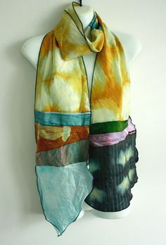 How fun! This one-of-a-kind scarf is handmade from my original handdyed silk fabrics I. It is constructed with serged seams, finished with black rolled hem.  Easy Care!  Hand washable, simply hang to dry, iron with steam if needed. Absolutely preshrunk, dyes won't fade or bleed. Handmade Artful Silk Scarves, Bohemian Hand-dyed Silk Scarf, Bohemian Hand-dyed Multicolor Silk Scarf, Bohemian Handmade Silk Scarves, Handmade Multicolor Silk Scarf, Handmade Multicolor Silk Scarves, Handmade Silk Bohemian Scarves, Handmade Silk Bohemian Scarf, Multicolor Hand Dyed Silk Scarves