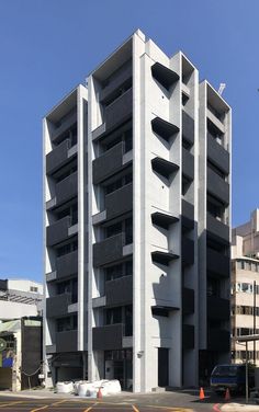 an apartment building with multiple balconies on the side