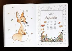 an open notebook with a drawing of a fox