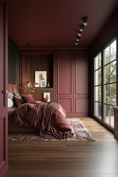 a bedroom with red walls and wooden floors