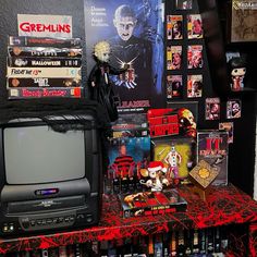 a collection of halloween movies and toys on a shelf