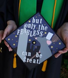 a person wearing a graduation cap that says, but only the fearless can be great