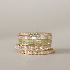 Adorn your finger with our Peridot Full Eternity Ring, a radiant celebration of August's birthstone. This exquisite piece showcases the warm allure of the green gemstone in a princess cut, offering a perfect blend of sophistication and individuality. Elevate your style with this timeless and vibrant symbol of elegance. Elegant Green Stackable Eternity Band, Green Diamond Eternity Band With Prong Setting, Classic Green Stackable Eternity Band, Elegant Green Emerald Cut Stackable Rings, Elegant Green May Birthstone Eternity Band, Elegant Green Diamond Eternity Band, Elegant Green Eternity Band For May Birthstone, Green Diamond Round Eternity Band, Elegant Green Stackable Jewelry