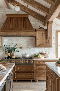 a large kitchen with wooden cabinets and white counter tops, along with an oven in the center