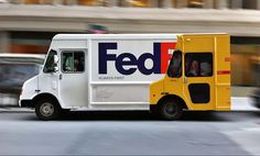 a fed - fi truck driving down the street