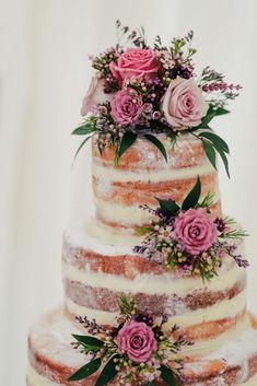 a three tiered cake with pink flowers on top and the words top cake ideas above it