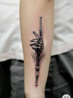 a tattoo on the arm of a person with a lizard crawling through it's skin