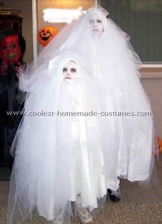 two people dressed up as ghost and bride