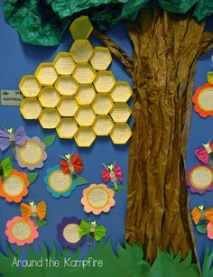 a bulletin board with paper flowers and trees