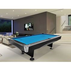 a pool table in the middle of a living room