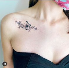 a woman with a butterfly tattoo on her chest