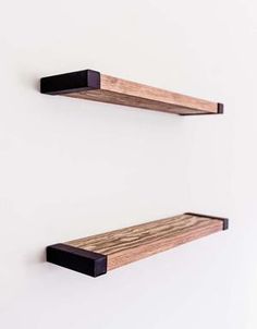 two wooden shelves mounted to the wall