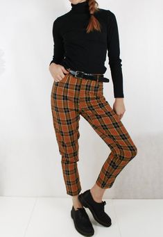 Fully lined check tartan patterned tapered Mom jean style chino/Capri pants in navy and chestnut brown colourway. Other colours available in our shop (see final photo). - Flattering high rise at the waist and narrow at the ankle - Two pockets - Belt loops - Fully lined Outer material is 100% cotton and looks great paired with Doc Martens and a navy ribbed turtle neck. Sizing: Sizes UK 6, 8, 10, 12, 14, 16, 18, 20 & 22 available, please see the last photo for sizing chart. Condition: New. Pos Colored Pants Outfits, Mom Jeans Style, Tartan Pants, Plaid Trousers, Square Pants, Country Fashion, Mom Jean, Chestnut Brown, Colored Pants