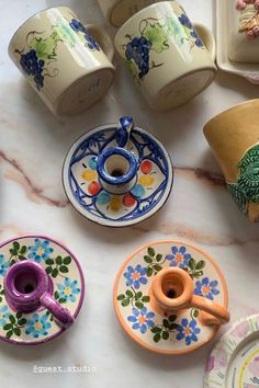 colorful dishes and cups on a marble table