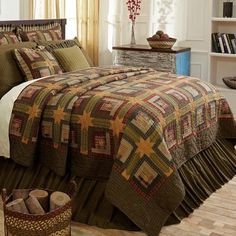 a bed room with a neatly made bedspread and pillows on the floor next to a window