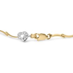 Embrace the allure of eternal love with this captivating two-tone gold diamond heart S-link bracelet. Exquisitely crafted in 10K two-tone gold, this enchanting piece is adorned with 45 natural round diamonds, boasting a total weight of 1/3 carat. These diamonds, with their I-J color, exude a delicate and timeless charm, while their I2-I3 clarity ensures a mesmerizing brilliance that catches the eye. Each diamond is meticulously set in a secure prong setting, allowing the light to dance off their Gold Heart Bracelet With Diamond Accents, Gold Diamond Heart Cut Bracelet, White Gold Heart Bracelet With Diamond Accents, Diamond Heart Bracelet For Anniversary, Yellow Gold Diamond Heart Bracelet In Fine Jewelry Style, Gold Diamond Bracelet With Heart Charm For Anniversary, Diamond Heart Cut Bracelet For Anniversary, Gold Heart Cut Diamond Bracelet For Anniversary, White Gold Diamond Heart Bracelet For Anniversary