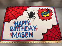 a spiderman birthday cake with the words happy birthday mason on it and a pop sign