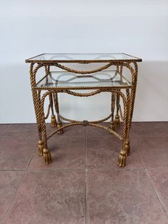 a glass topped table on tile flooring