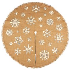 a round piece of cloth with snowflakes printed on it and fringes around the edges