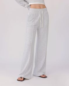 The BEO PANTS in HEATHER GREY are a must-have for comfort and style. Made with super soft mid-weight terry fabric, these straight leg pants offer a relaxed fit and feature a smocked drawstring elastic waist for a personalized fit. With convenient side slant pockets, these pants are both functional and fashionable. DETAILS: Color: Heather Grey Super soft mid-weight terry fabric Straight leg relaxed fit Smocked drawstring elastic waist Side slant pockets 54% Cotton, 46% Polyester Machine wash SIZE Gray Straight Leg Bottoms For Leisure, Gray Straight Leg Leisure Pants, Gray Straight Leg Pants For Leisure, Leisure Gray Straight Leg Pants, Heather Grey Relaxed Fit Sweatpants For Loungewear, Relaxed Leisure Pants With Straight Hem, Relaxed Straight Hem Leisure Pants, Heather Grey Relaxed Fit Bottoms For Loungewear, Gray Wide-leg Loungewear Bottoms