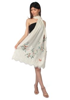 Indulge in the timeless allure and purity of our ivory cashmere scarf. Its delicate multi-colored floral embroidery combined with tonal ivory filigree lace at the ends, creates an exquisite blend of sophistication and uniqueness. This scarf offers both warmth and style, making it a must-have accessory for any occasion. Elegant White Fabric With Chikankari Embroidery, Elegant White Chikankari Embroidered Fabric, Elegant Beige Floral Embroidered Fabric, Elegant Off-white Embroidered Fabric With Floral Design, Elegant Off-white Fabric With Floral Embroidery, Elegant Cream Embroidered Shawl, Elegant White Shawl For Spring, Elegant Beige Dupatta For Spring, Elegant Embroidered Wedding Scarf