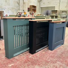 three different colored cabinets in a warehouse