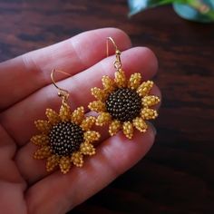 Two small and dainty sunflowers, hand beaded using hundreds of super-tiny glass beads, strung and stitched one at a time. Mini sunflowers measure just over 1 inch (28mm) each. Total length of earrings with ear wires: 1.5 inches (40mm.) © 2020-2021 Heart in Hawaii Available in larger size; sold separately Matching brooch available; sold separately Professionally handmade in the US Truly unique; exclusive design; direct from the artist Gift wrapping and 1st Class US shipping included Bohemian Sunflower Design Jewelry With Round Beads, Gold Bead Caps Jewelry For Crafting, Gold Jewelry Bead Caps For Crafting, Adjustable Gold Beaded Flower Earrings, Yellow Bohemian Jewelry With Sunflower Design, Gold Flower Beaded Earrings As Gift, Gold Beaded Flower-shaped Earrings, Gold Beaded Flower Earrings, Handmade Gold Flower Earrings With Round Beads