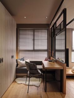 a living room filled with furniture next to a window covered in blindes and blinds