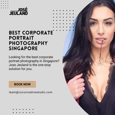 a woman with long dark hair wearing a black top and posing for the camera in front of a white background