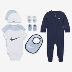 The perfect gift for the smallest athletes, this set contains multiple head-to-toe coordinated looks. The bodysuits have lapped shoulders and snappy tape closures at the crotch that make changing and dressing easy, and the matching bib has hook-and-loop closures for a comfy fit. The cozy, footed coverall has a full-zip closure to make changing, dressing and layering easy. Nike Baby Clothes, Baby Nike, Cute Baby Boy Outfits, Newborn Boy Clothes, Baby Fits, Baby Must Haves, Baby Gift Sets, Short Sleeve Bodysuit, Newborn Boy