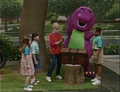 the backyardigans are talking to each other in front of a purple dinosaur statue