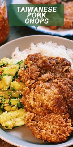 fried pork chops with rice and vegetables on a plate