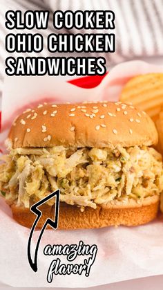 a close up of a sandwich and fries on a plate with the words slow cooker chicken sandwiches