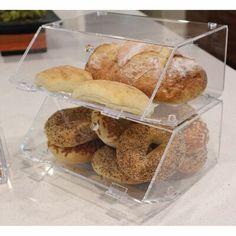 several different types of pastries are stacked on top of each other in a display case