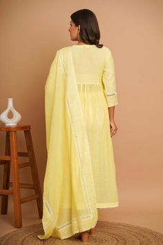 Lemon yellow three fourth sleeves Aliya cut gathered flare anarkali with gardenia fleur embroidery all over and lace detailing. Paired with a lace embroidered hem pant and lace embellished dupatta. - Aza Fashions Embroidered Anarkali, Embroidered Hem, Women Kurta, How To Hem Pants, Set Women, Lemon Yellow, Yellow Floral, Anarkali, Aza Fashion