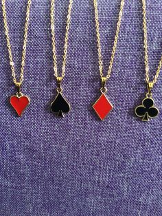 (18,027) Card Game Suits Necklaces and Earrings  Gold Tone Enamel  Hearts: 1/2" x 1/2" Spades: 1/2" x 1/2" Diamonds: 5/8" x 1/2" Clubs: 1/2" x 1/2" Earrings on gold tone stainless ear wires Necklaces on 16" gold tone stainless chain Necklaces On Playing Cards, Suit Jewelry, Diamond Card, Card Suits, 2 Earrings, Wire Necklace, Fashion Life, Necklace And Earrings, Matching Necklaces