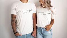 This t-shirt is the perfect way to celebrate your recent marriage or engagement. The shirt features a simple yet stylish design with the words "Mrs. LastName" with Est 20xx below it. Made from a soft and comfortable fabric, this shirt is perfect for any casual occasion. Whether you're enjoying a night out with your spouse or running errands around town, this shirt will let everyone know that you're a newlywed. Wear it with a pair of jeans and sneakers for a laid-back look, or dress it up with a Wifey Shirt, Gift For Groom, Groom Shirts, Honeymoon Shirts, Bride Shirt, Matching Couple Shirts, Couple Shirt, Gift For Bride, Bride Shirts