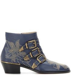 a pair of blue boots with gold studdings